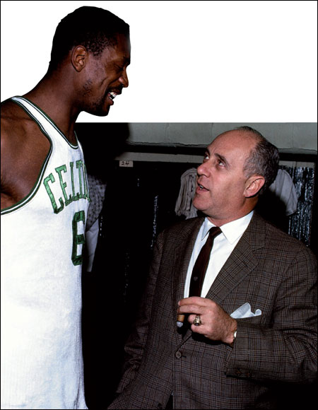  Head coach of the Boston Celtics, 'Red' Auerbach talks with centre Bill Russell in the locker room. The Celtics won eight straight NBA titles - the longest winning run in North American sports.