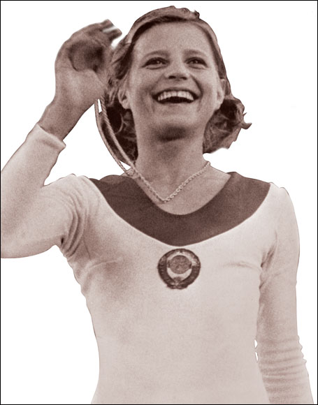  Russian Olga Korbut, 15, displays one of the three gold medals (floor exercise, balance beam and team competition) she won during the 1972 Munich Olympics.