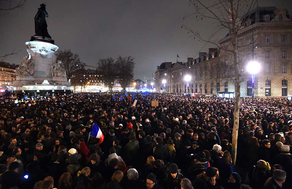 People gather at the Place de la Republique (Republic square) in Paris, on January 7, 2015, following an attack by unknown gunmen on the offices of the satirical weekly, Charlie Hebdo. France's Muslim leadership sharply condemned the shooting at the Paris satirical weekly that left at least 12 people dead as a "barbaric" attack and an assault on press freedom and democracy.