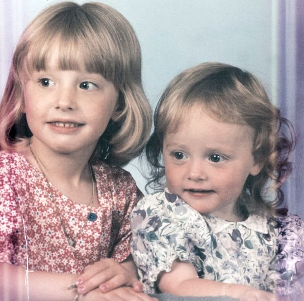 Hollie at age three (right), with her sister Chloe, then six