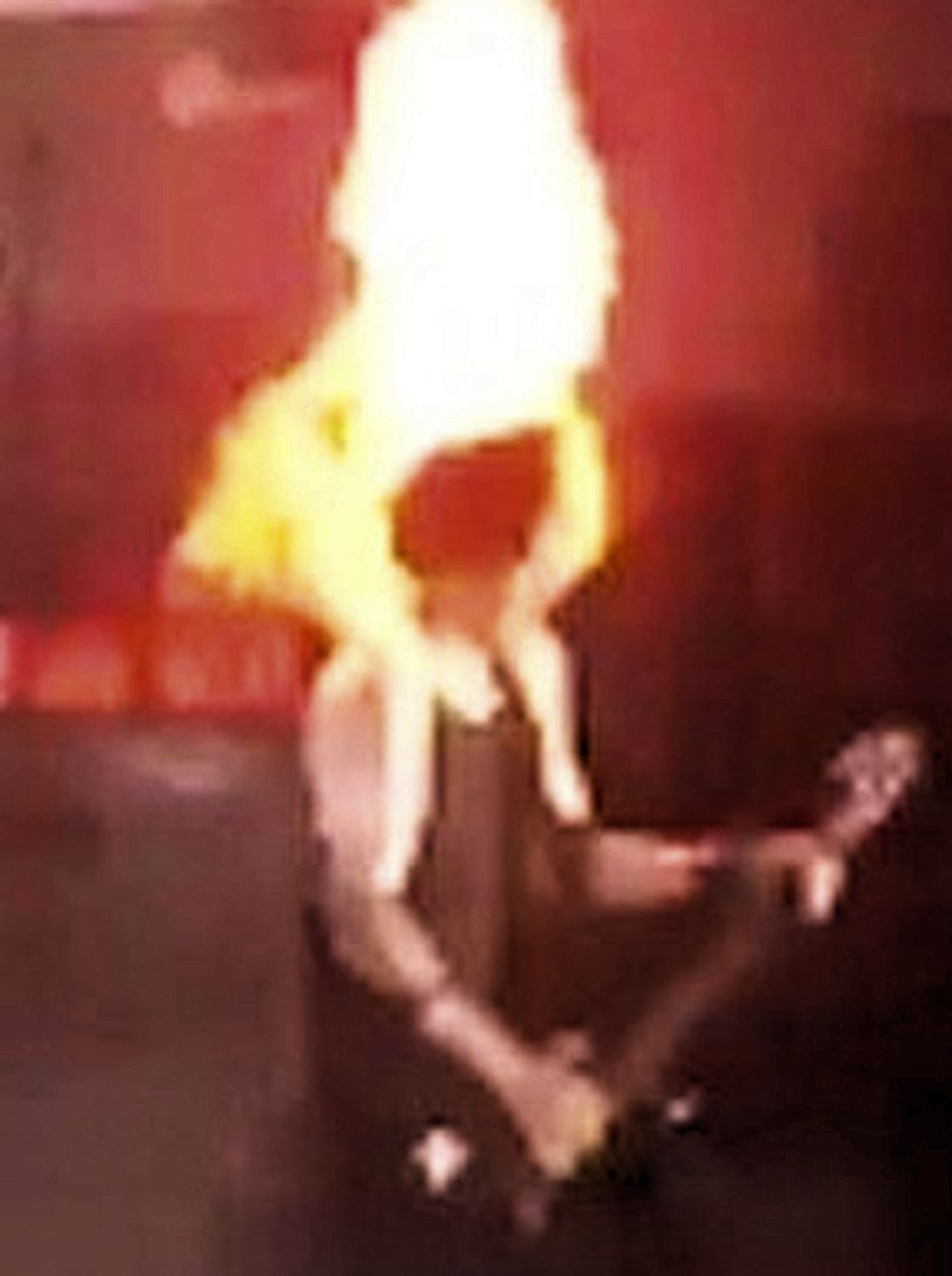 The guitarist used a towel to try to extinguish the flames