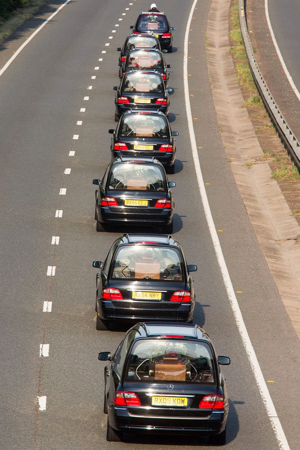 Procession of hearses leaving Brize Norton