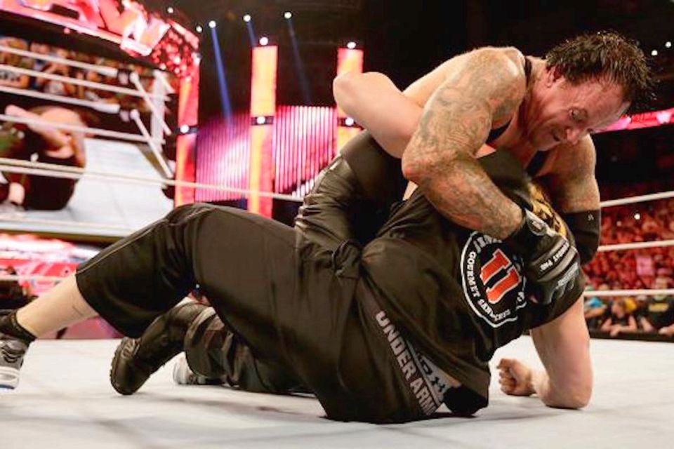  The Undertaker brawls with Brock Lesnar  to set up their SummerSlam clash