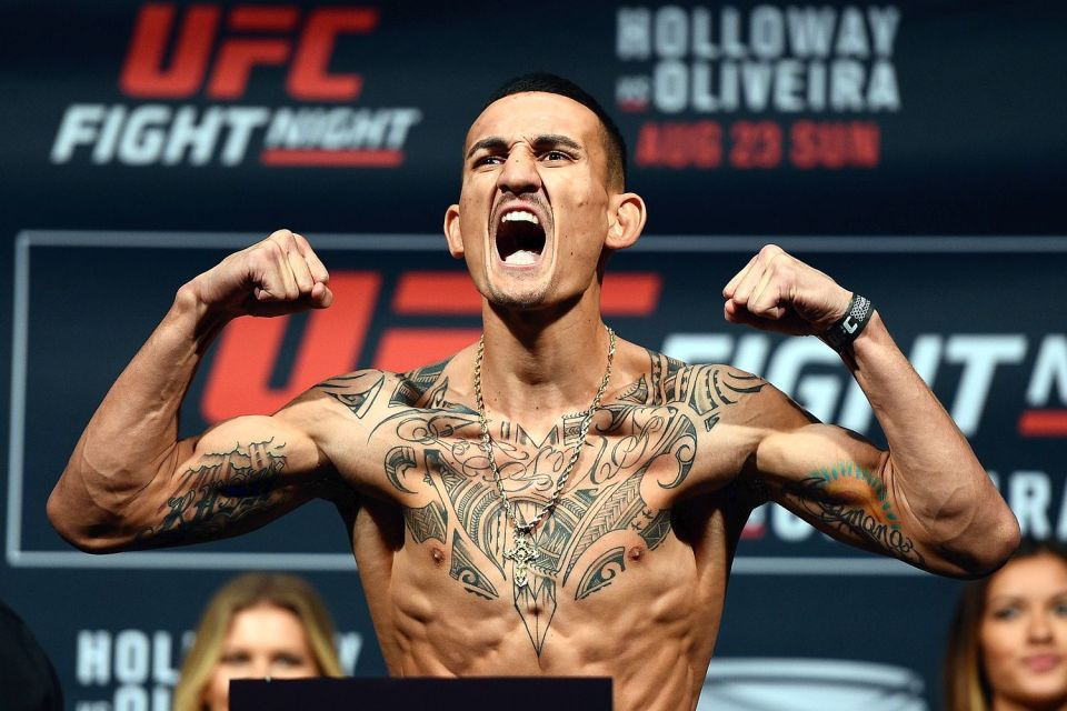  On the money: Max Holloway hit championship weight at Friday's early morning official weigh-ins in Toronto