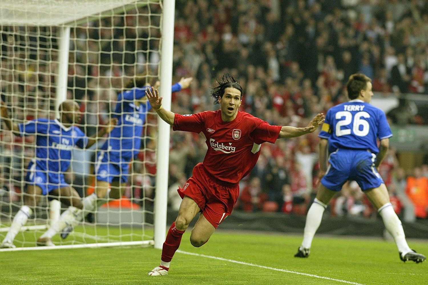 Luis Garcia celebrates as Chelsea protest to the referee