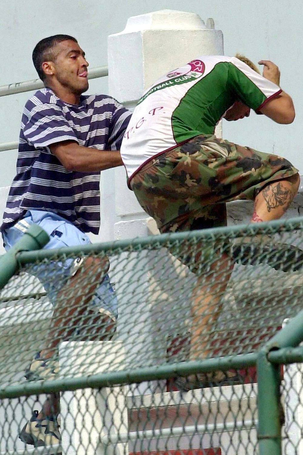 Romario scraps with Fluminense fan, Ricardo Gomes,  after he threw six live chickens onto the practice field