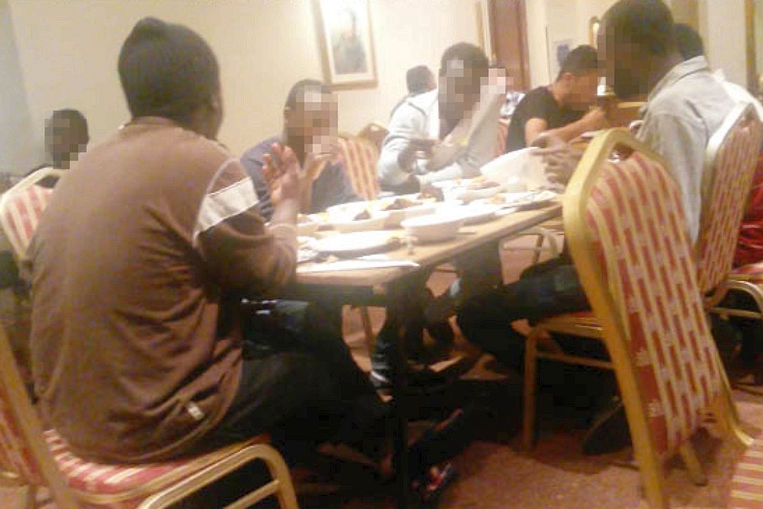 Help yourself ... asylum seekers tuck into three-course meal at hotel in Stockport