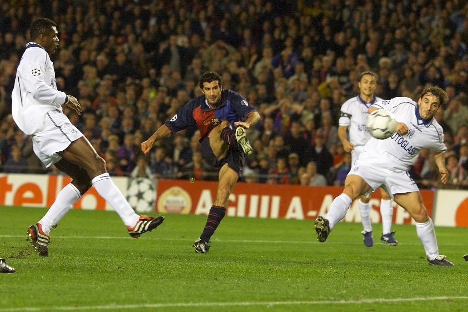 Luis Figo finishes off to put Barcelona 2-0 ahead at Stamford Bridge