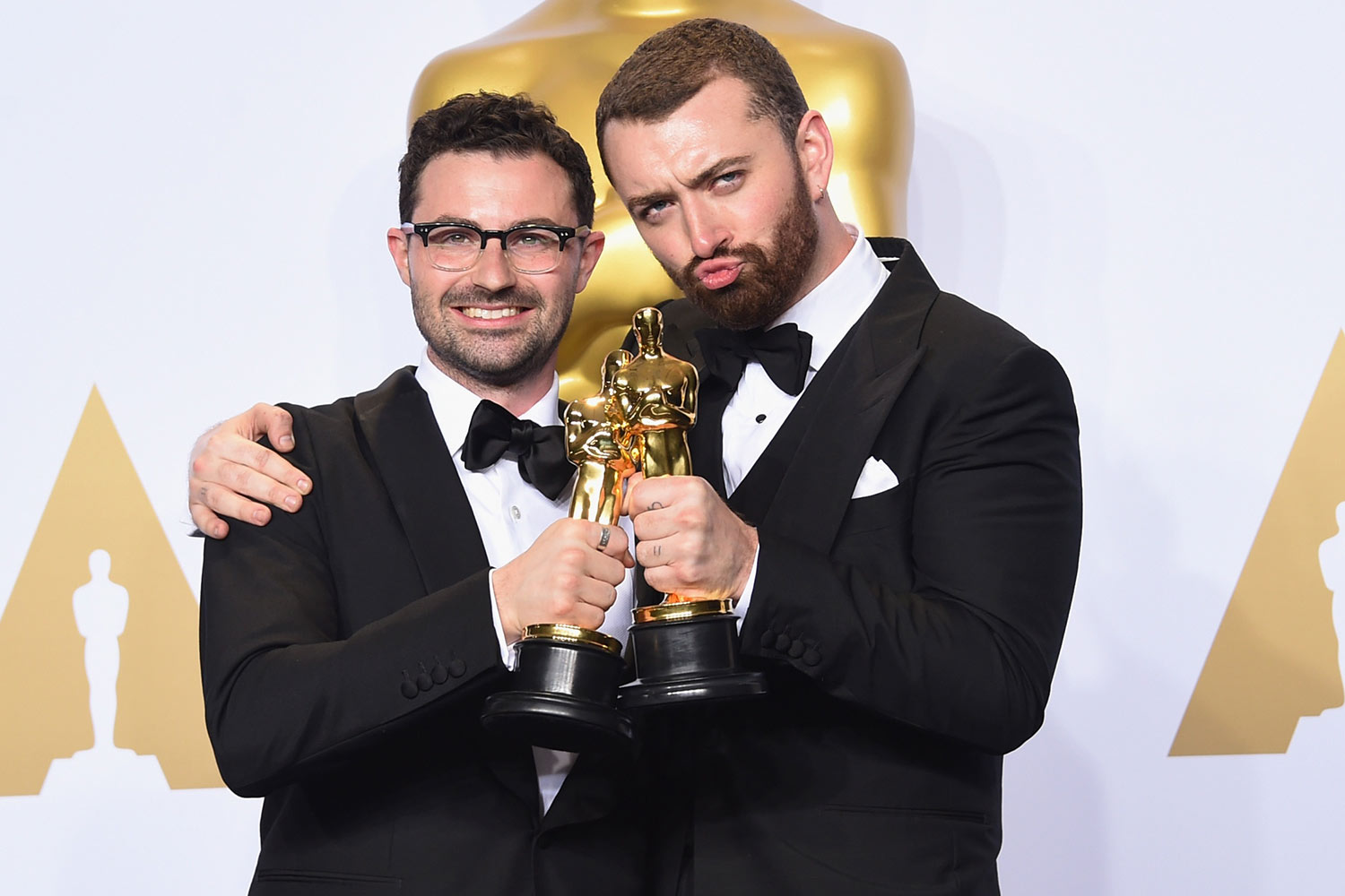 Songwriter Jimmy Napes (L) and singer Sam Smith, winners of the award for Best Original Song 'Writing's on the Wall,' pose in the press room during the 88th Annual Academy Awards at Loews Hollywood Hotel on February 28, 2016 in Hollywood, California.