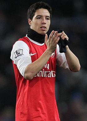  Nasri, who also played for City, wears a snood during an Arsenal game