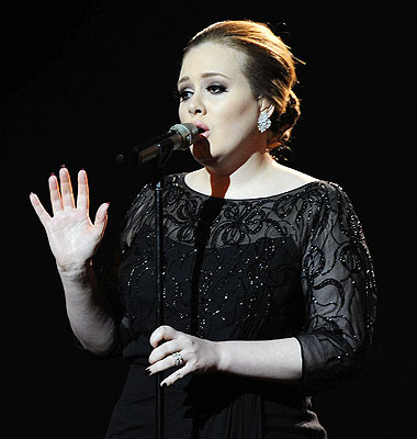 ADELE PICTURED PERFORMING LIVE ON STAGE DURING THE 2011 BRITS