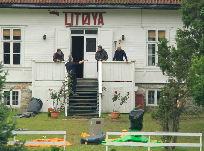 Police continue their investigations on the Utoeya island in the Tyrifjorden lake, where Friday's shooting massacre took place, July 25, 2011.