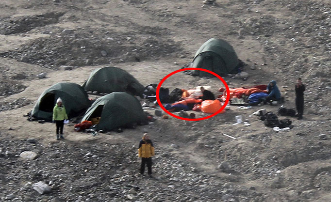 shows the campsite with what appears to be the dead bear in middle of the shot.
A polar bear mauled to death a British man and left four others seriously injured in a horror attack in Norway today.