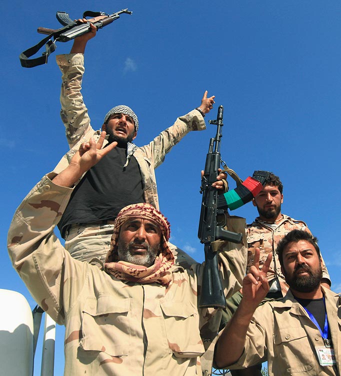 Anti-Gaddafi fighters celebrated the fall of Sirte October 20, 2011. Libyan interim government fighters captured Muammar Gaddafi's home town on Thursday, extinguishing the last significant resistance by forces loyal to the deposed leader and ending a two-month siege.