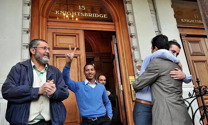 Libyan's celebrate at the Libyan Embassy after hearing of the news that Libya's ex-leader Col Muammar Gaddafi was killed after an assault on his home town of Sirte, London, Britain, 20 October 2011.