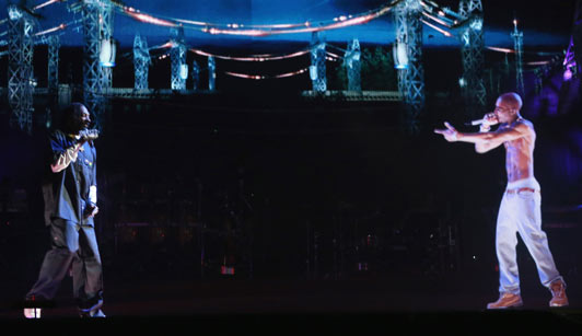 Rapper Snoop Dogg (L) and a hologram of deceased Tupac Shakur perform onstage during day 3 of the 2012 Coachella Valley Music & Arts Festival at the Empire Polo Field on April 15, 2012 in Indio, California