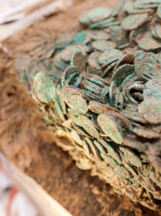 JERSEY, UNITED KINGDOM, JUNE 26, 2012: Two metal detector enthusiasts have uncovered Europe's largest hoards of Iron Age coins worth up to GBP10 million - after searching for more than 30 YEARS (PICTURED). Refer to SWNS story SWCOINS. Determined Reg Mead and Richard Miles spent decades searching a field in Jersey after hearing rumours that a farmer had discovered silver coins while working on his land. They eventually struck gold and uncovered between 30,000 and 50,000 coins, which date from the 1st Century BC and have lain buried for 2,000 years. The Roman and Celtic silver and gold coins were entombed under a hedge in a large mound of clay, weighing three quarters of a ton and measuring 140 x 80 x 20cm. Experts predict they are of Armorican (corr) origin - mode