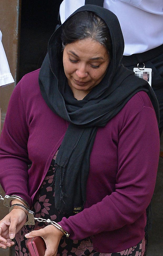 Pictured is Farzana Ahmed being taken from Chester crown court today