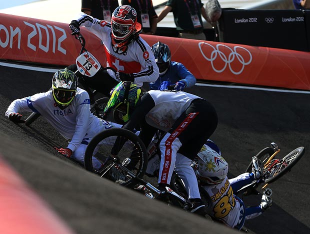 Manuel de Vecchi (L) of Italy goes to ground as the pack crash on the berm during the Men's BMX Cycling Quarter Finals