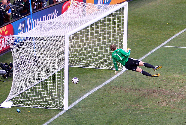 Manuel Neuer of Germany watches the ball bounce over the line from a shot that hit the crossbar from Frank Lampard of England, but referee Jorge Larrionda judges the ball did not cross the line during the 2010 FIFA World Cup South Africa Round of Sixteen match between Germany and England at Free State Stadium on June 27, 2010 in Bloemfontein, South Africa.