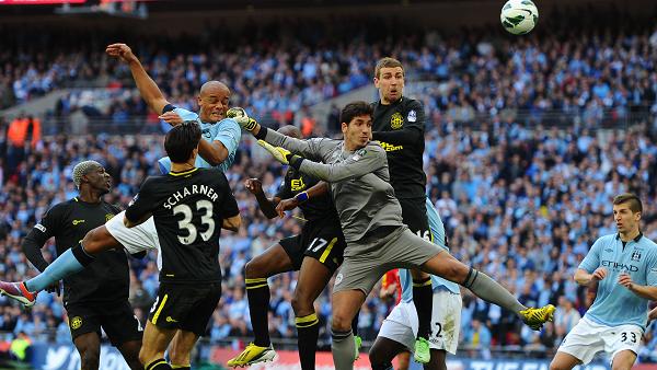 Wigan keeper Joel Robles comes for a dangerous cross