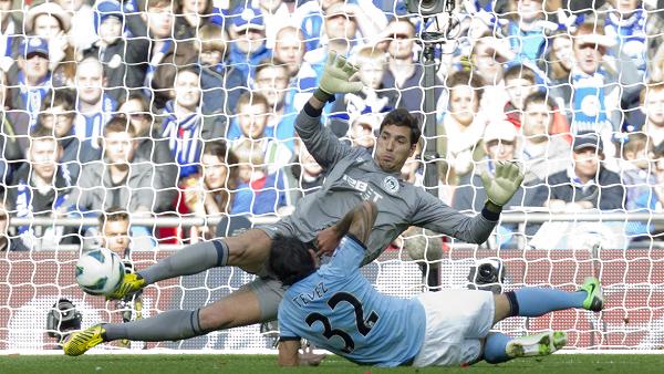 Wigan keeper Joel Robles pulls off an incredible save from Carlos Tevez