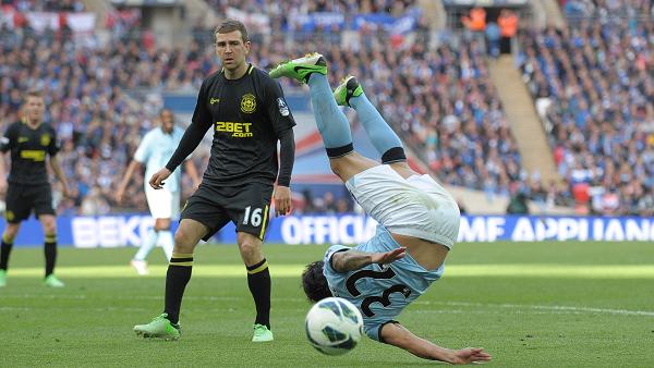 Carlos Tevez tumbles