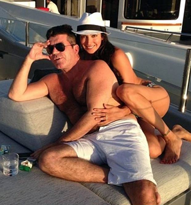 Lauren Silverman of herself in a bikini, snuggling with Simon Cowell on his yacht during a holiday in St Barts