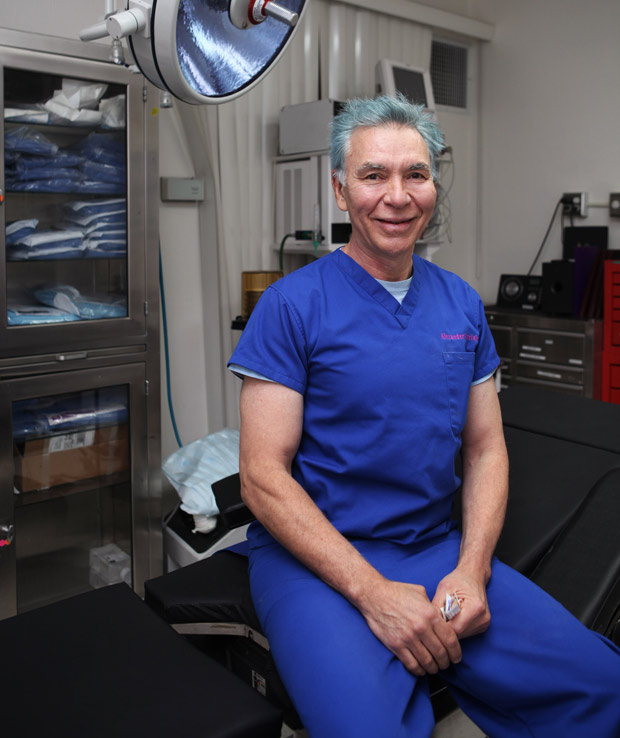 Plastic surgeon Alexander Sinclair at his Beverly Hills clinic in Los Angeles, California. MEGA-busty Elizabeth Starr fears her banned boob job will kill her after her breasts ballooned to a whopping O cup. The adult film star had now-illegal 'string' implants 15 years ago to boost her career - but says her life has been ruined by her super-sized chest.