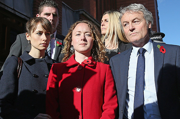 Don Maguire (R) and his daughters Emma (front left) and Kerry (front centre), the family of murdered teacher Ann Maguire, stand outside Leeds Crown Court