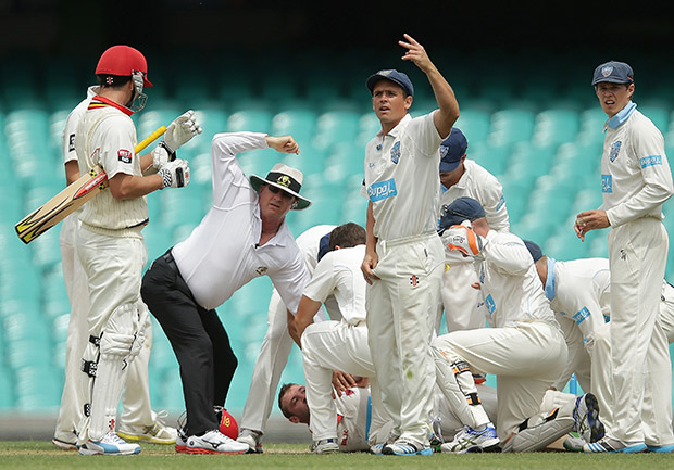 Phillip Hughes of South Australia falls to the ground after being struck in the head by a delivery during day one of the Sheffield Shield match between New South Wales and South Australia at Sydney Cricket Ground on November 25, 2014 in Sydney, Australia.