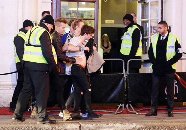 SINGER CONNOR BALL FROM THE VAMPS PICTURED GETTING ESCORTED OUT BY SECURITY AND GETTING CARRIED