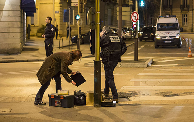 olicemen collect evidence on December 21, 2014 in Dijon on the site where a driver shoutin