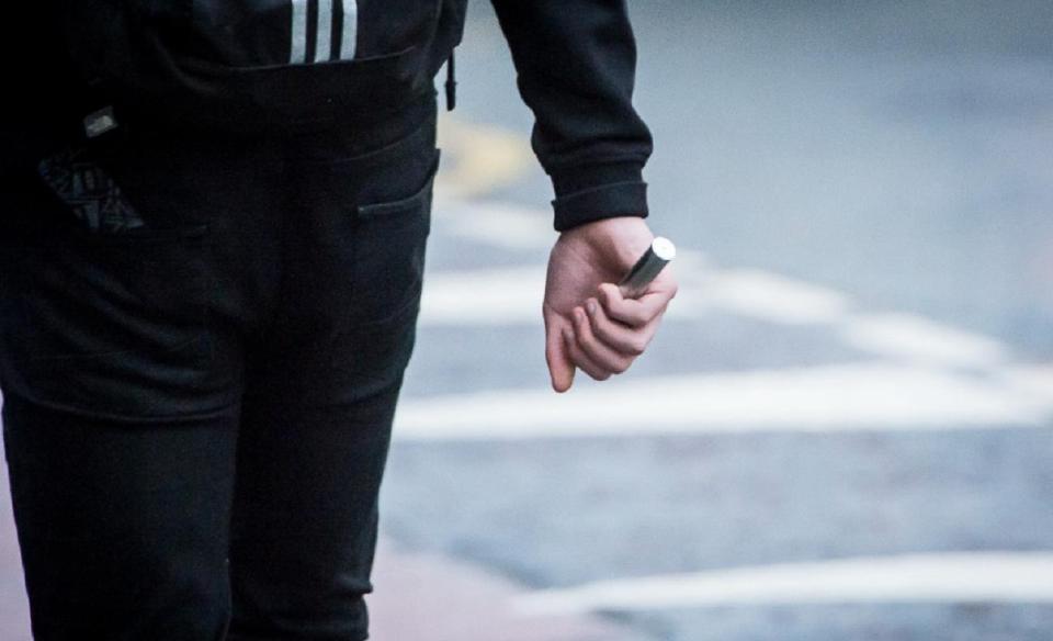  A pupil walking with his e-cigarette