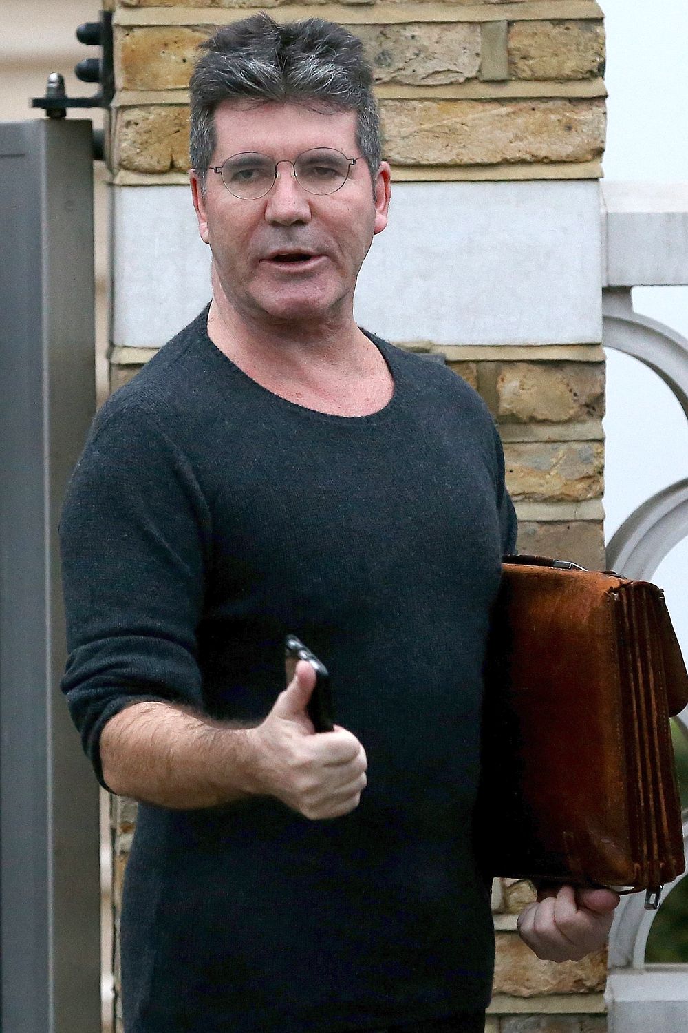 Alarmed . . . Simon Cowell at his house