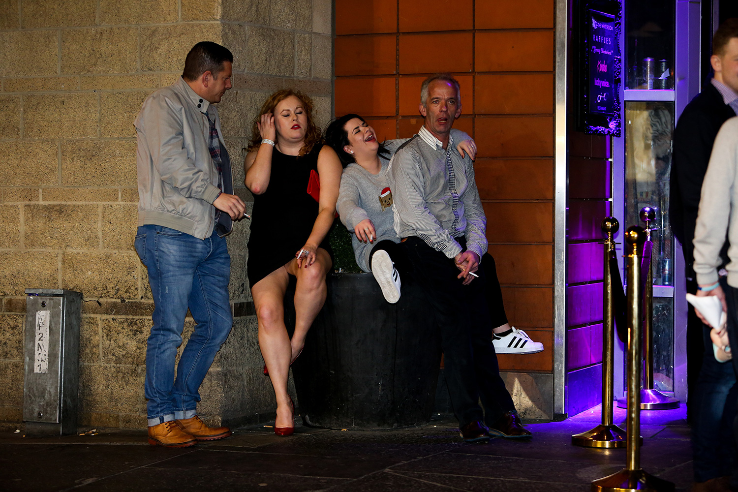 Drinkers rest outside a bar on black eye Friday in Newcastle. December 18 2015.