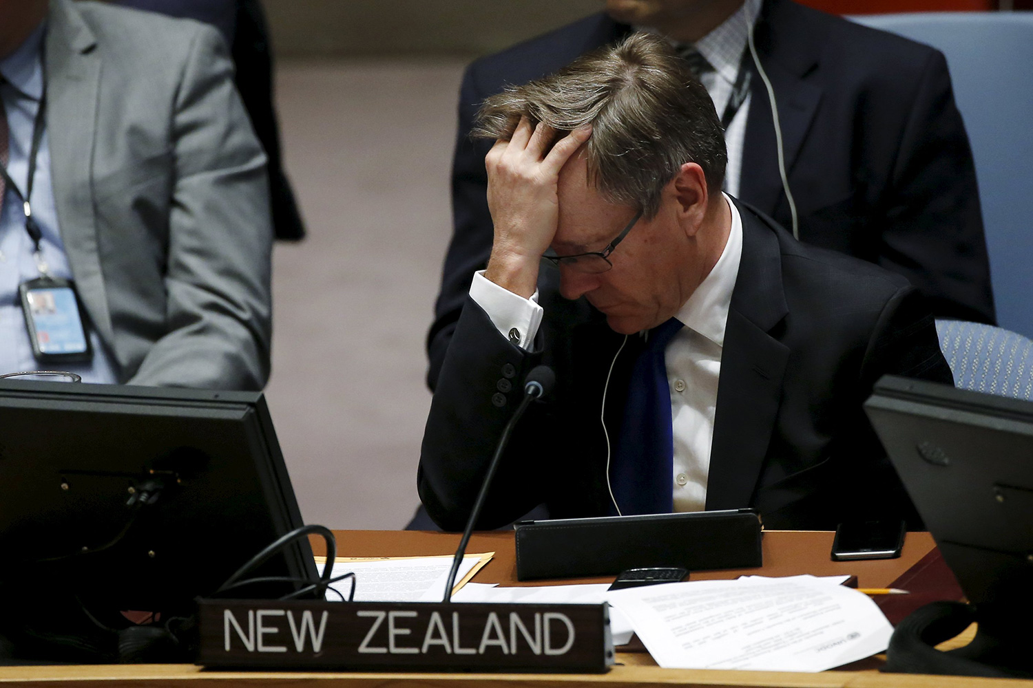 Gerard Van Bohemen, New Zealand permanent representative to U.N., reacts while he listens to Nadia Murad Basee, a 21-year-old Iraqi woman of the Yazidi faith speaking to members of the Security Council during a meeting at the United Nations Headquarters in New York, December 16, 2015.