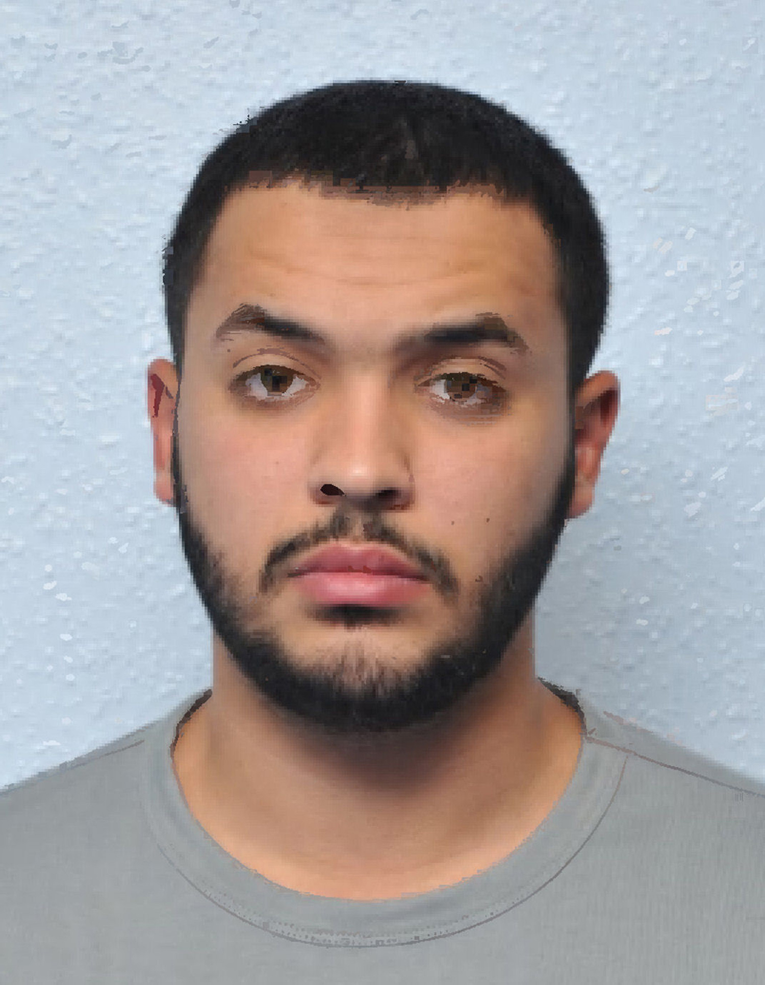 This image made available by the Metropolitan Police in London, Wednesday, March 23, 2016, shows Tarik Hassane. Two home-grown British extremists face long prison terms for conspiring to kill soldiers, police officers and civilians in west London. Tarik Hassane, 22, had pleaded guilty during the trial at London's Old Bailey courthouse. Physics student Suhaib Majeed, 21, was convicted Wednesday of conspiracy to murder and preparing terrorist acts. They had planned to shoot from an untraceable moped and then ride off. (Metropolitan Police via AP)