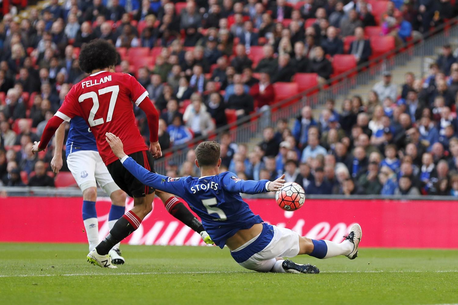 Fellaini skips ahead of John Stones for the first goal