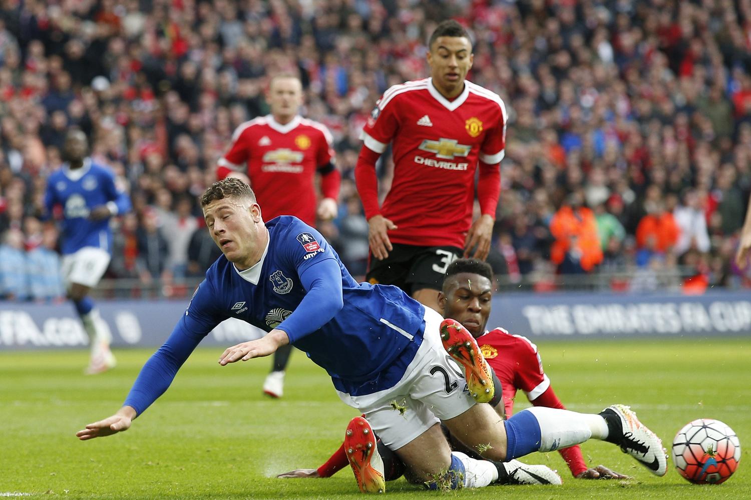 Ross Barkley takes a tumble in the box after Timothy Fosu-Mensah's challenge