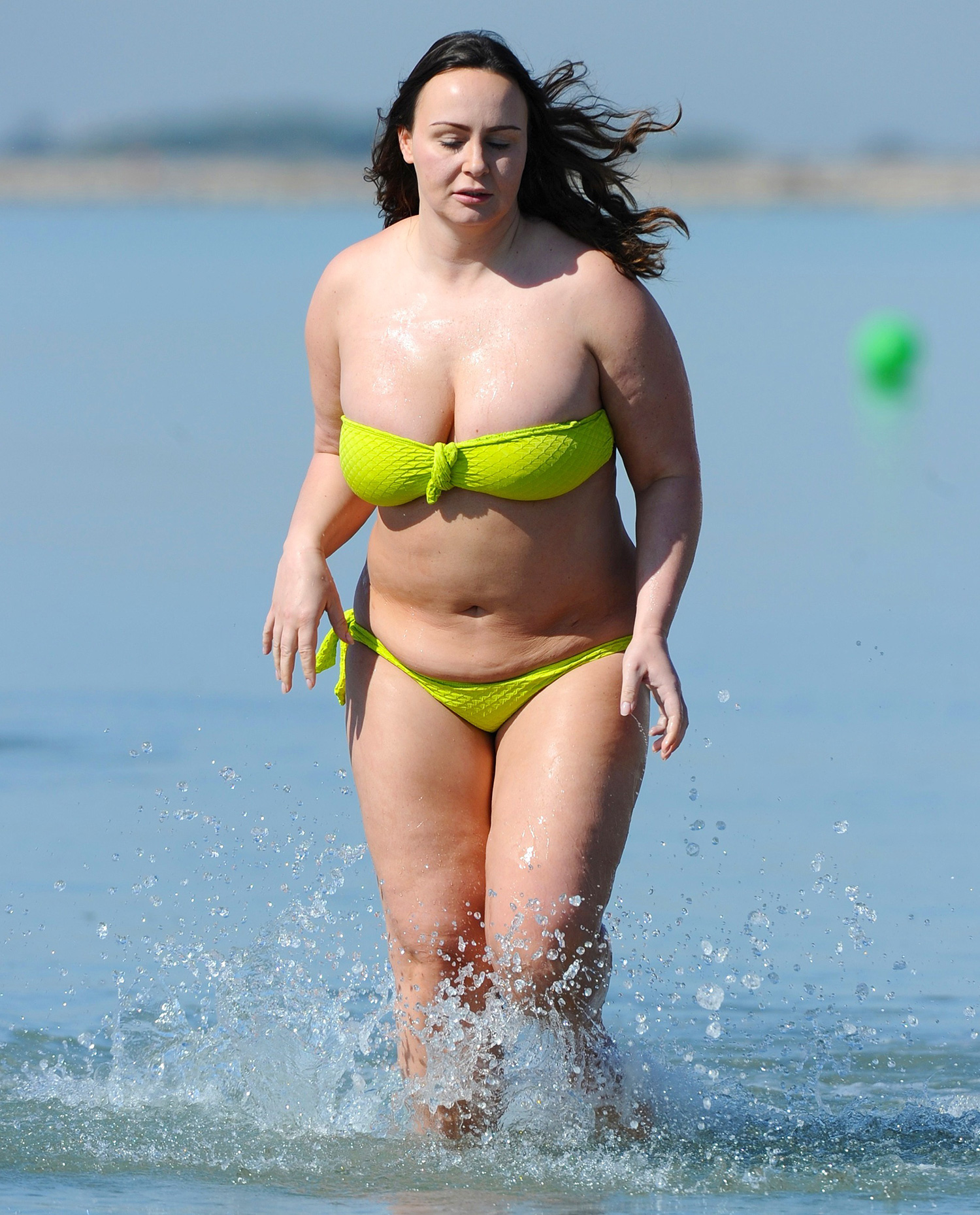 Chanelle Hayes March 30, 2016 * Min Web / Online Fees £500 For Set * Chanelle Hayes shows off her full figure in a lime green bikini at the beach in Alicante, Spain