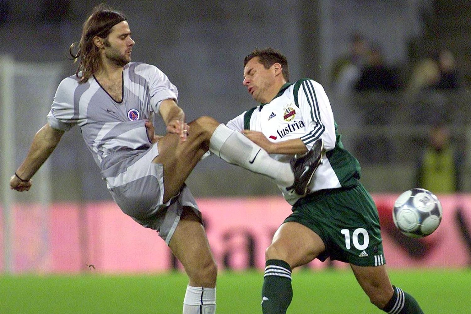 Pochettino is challenged during his playing days at Paris Saint-Germain