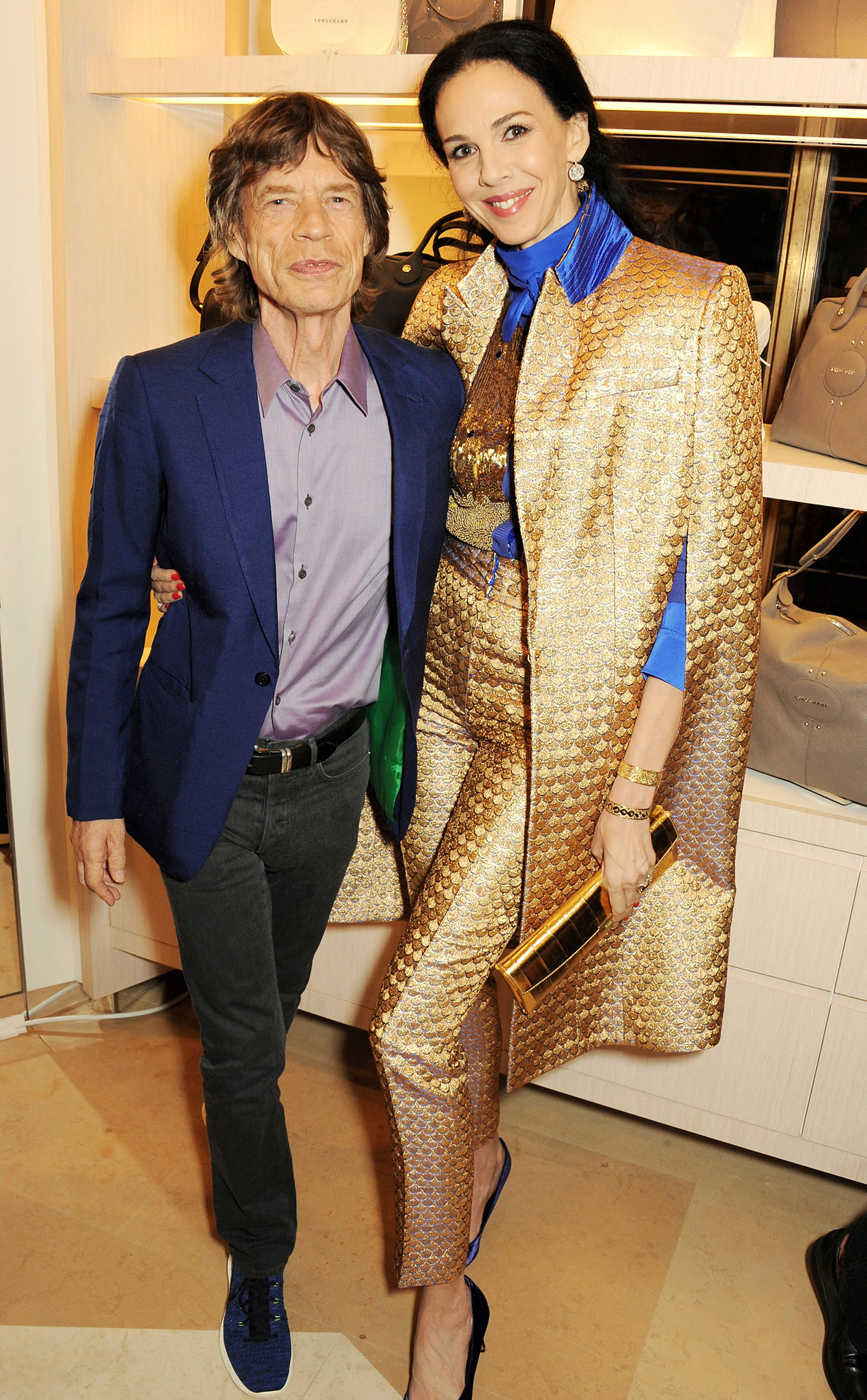 LONDON, ENGLAND - SEPTEMBER 14: Sir Mick Jagger (L) and L'Wren Scott attend the launch of the Longchamp London flagship store on September 14, 2013 in London, England.