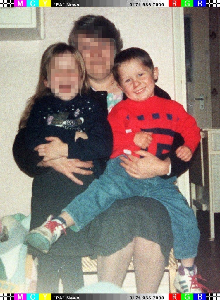  Six-year-old Rikki Neave with an unidentified woman and his sister taken before he was murdered in Peterborough in 1994