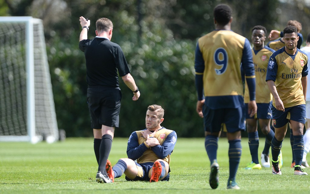  Jack Wilshere takes a knock but gets back up against Swansea