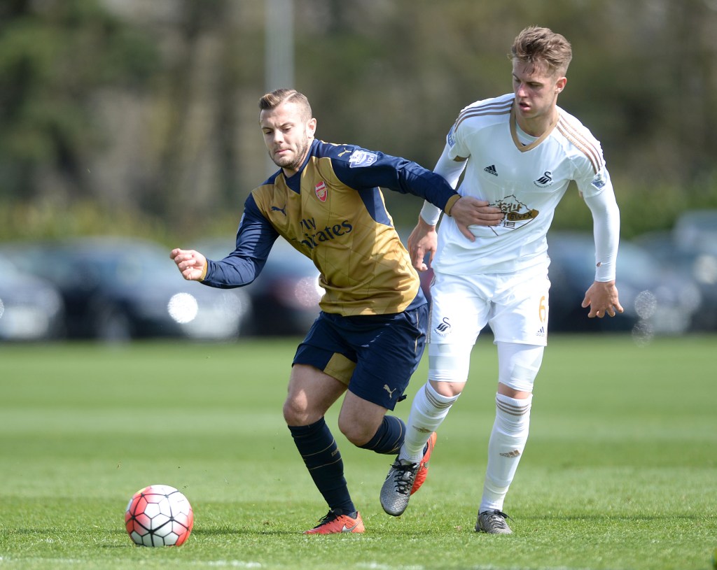  Jack Wilshere runs with the ball against Swansea Under-21s