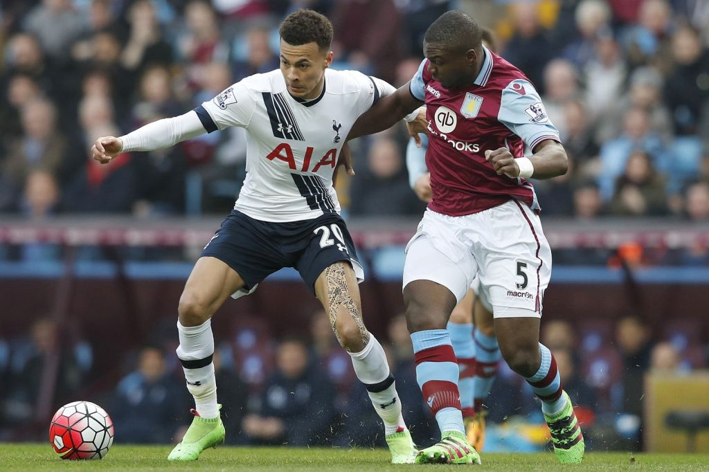  Dele Alli holds of Jores Okore during Tottenham's Premier League clash with Aston Villa