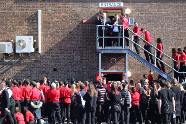  No match ... members of staff wait outside the ground following a security alert and the subsequent match abandonment