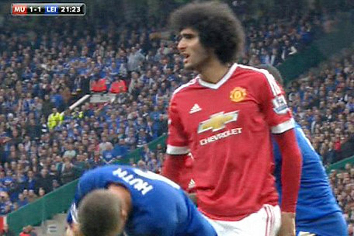 Huth covers his face after Fellaini aims an elbow at him