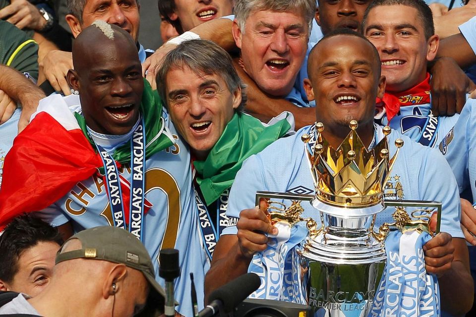  Vincent Kompany with the Premier League title after their dramatic victory over QPR